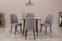 Set da tavola rotonda estendibile e 4 sedie Malva in legno scuro e tessuto grigio chiaro.