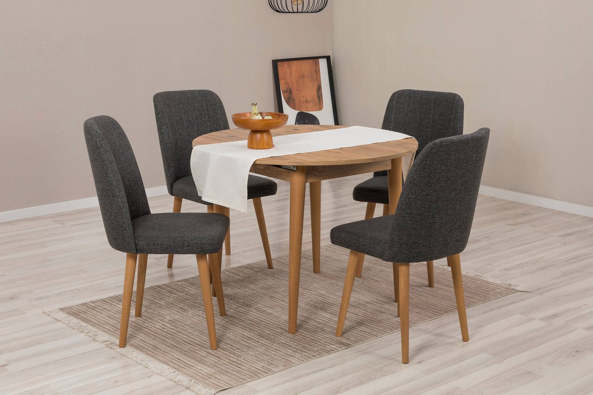 Esstisch-Set mit ausziehbarem runden Tisch und 4 Stühlen Malva, helles Holz und anthrazitfarbenem Stoff.