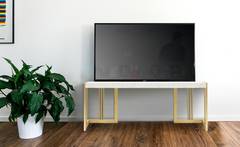 Meuble TV design 140cm Locaro Marbre Blanc et pieds Métal Or